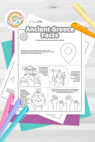 Black and white coloring pages with Ancient Greece facts lying on top of blue-green and purple sheets with assorted crayons on a dark grey background.