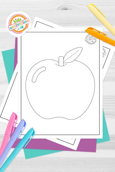 Black and white apple template printable on top of blue-green and purple sheets with assorted markers on a dark grey background. printed pdf version from Kids activities blog.