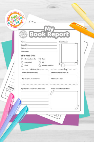 Black and white printed book reporte template on top of blue-green and purple sheets with assorted markers on a dark grey background. printed pdf version from Kids activities blog.
