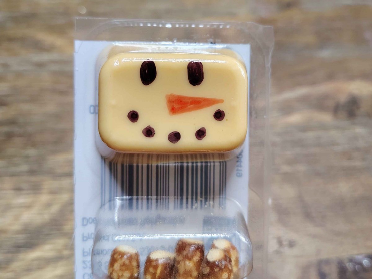 Christmas Snacks Craft- Step 3- Black dots into a smile - Kids Activities Blog