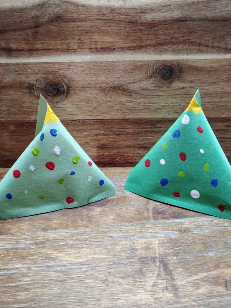 Christmas Tree Treat Bags- Step 7- Finger paints on pyramid to look like Christmas tree- Kids Activities Blog