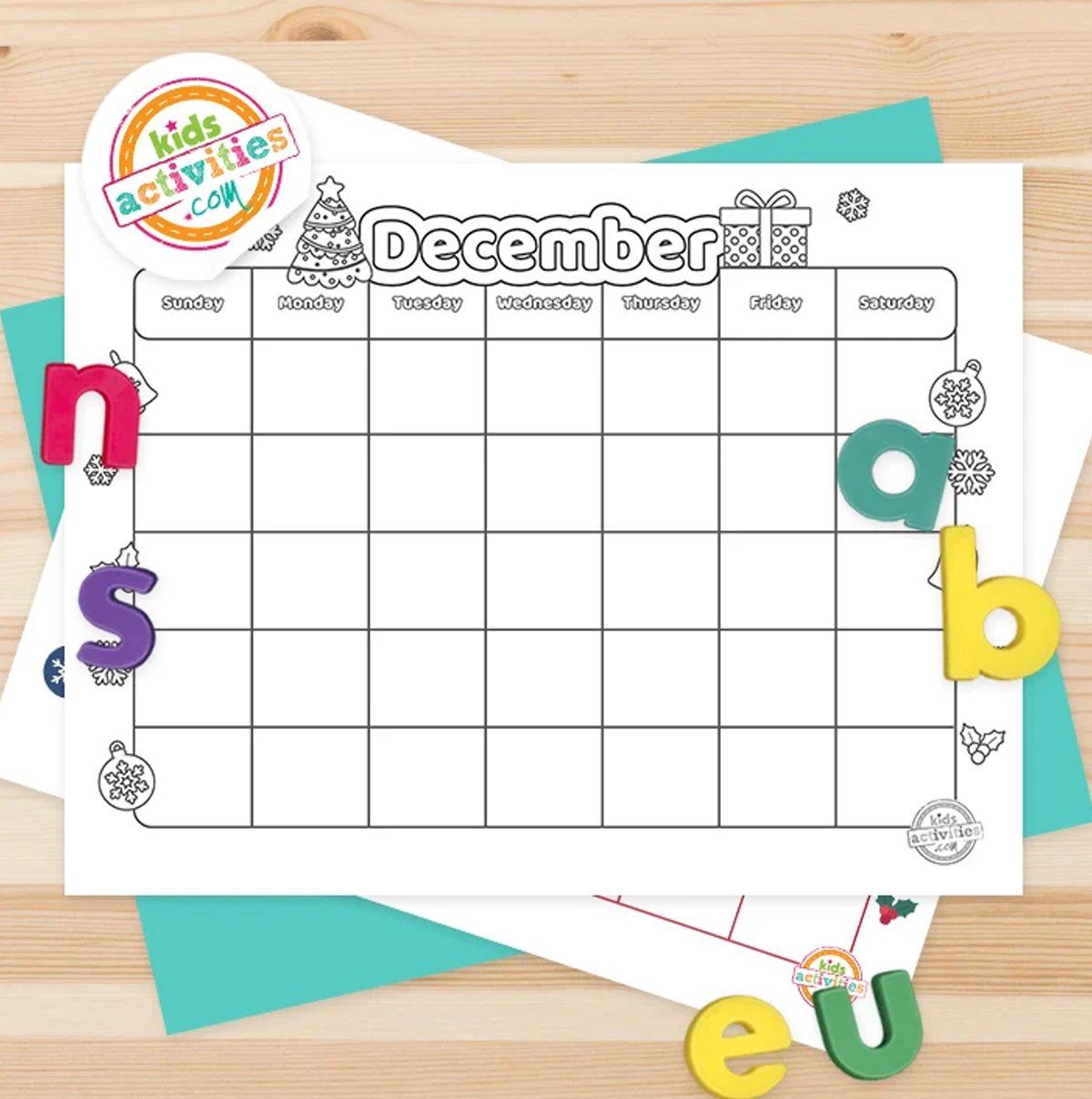 Stack of printed december calendars printables on top of green and purple pages, with markers next to them, on top of a brown background.
