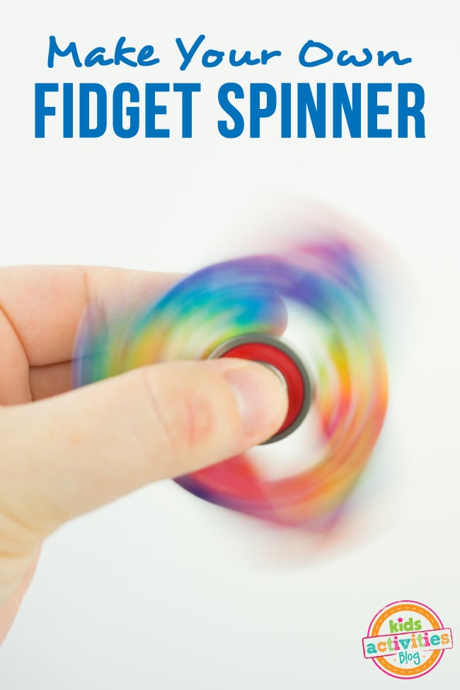 How to Make a Fidget Spinner - make your own DIY fidget spinner craft - fingers holding spinning spinner shown with rainbow colors