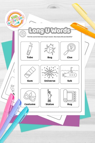 Black and white printed long U words worksheets on top of blue-green and purple sheets with assorted markers on a dark grey background. printed pdf version from Kids activities blog.