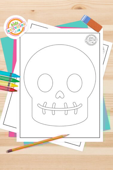 Black and white skull template printable on top of blue-green and purple sheets with assorted markers on a dark grey background. printed pdf version from Kids activities blog.