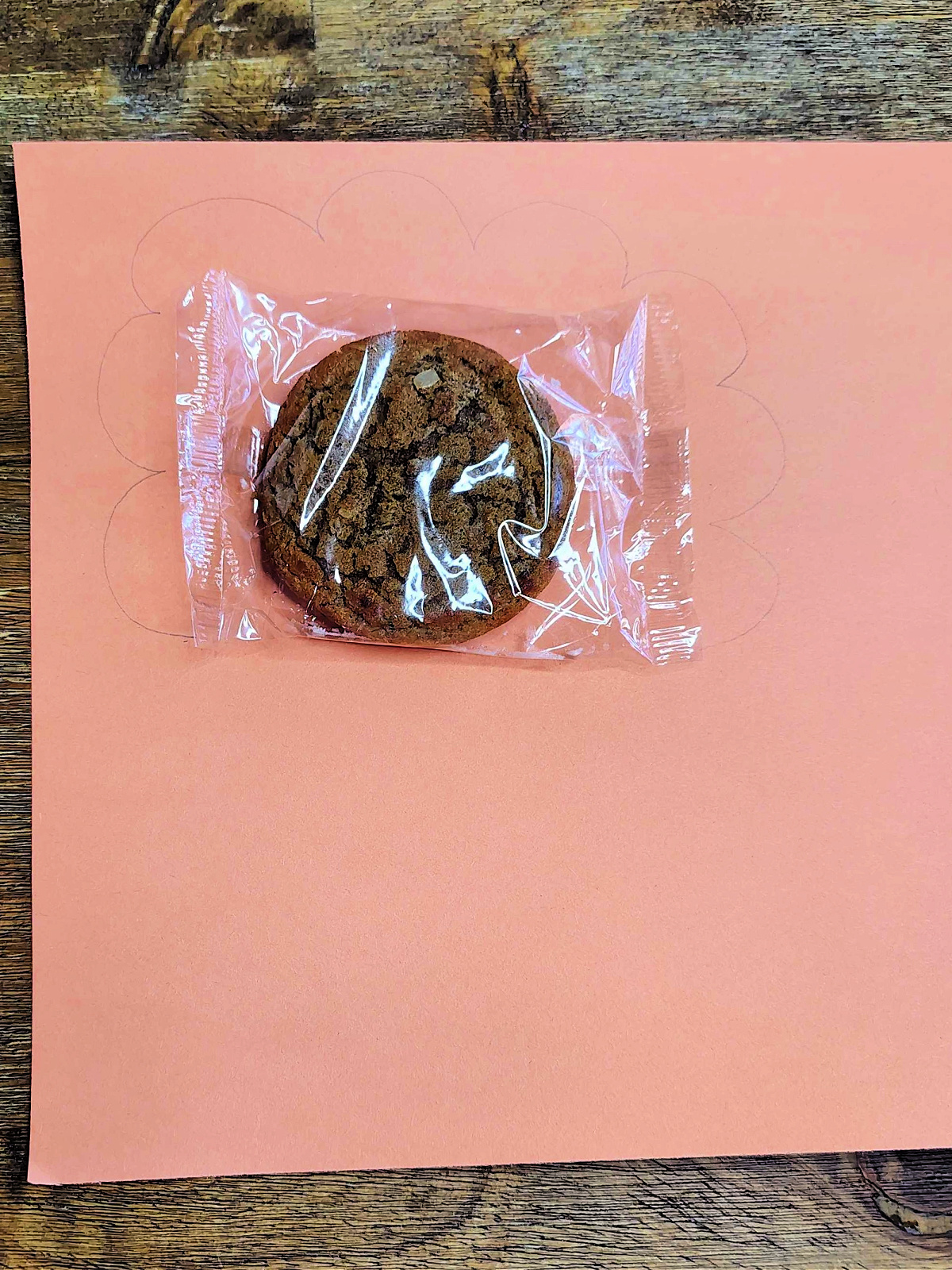 Turkey Craft- Step 1- cookie on an orange piece of paper- Kids Activities Blog