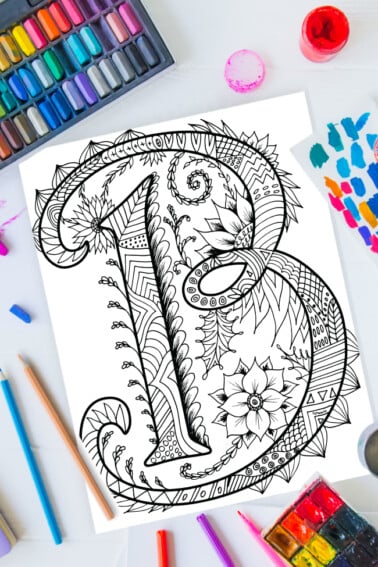 Zentangle alphabet coloring pages - letter b zentangle design on background of paint, colored pencils and art supplies