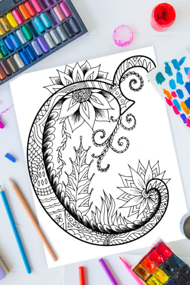 Zentangle alphabet coloring pages - letter c zentangle design on background of paint, colored pencils and art supplies