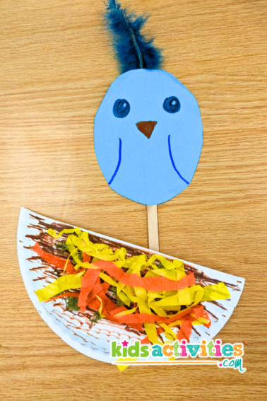 Finished paper plate bird nest puppet art project. - kidsactivities.com