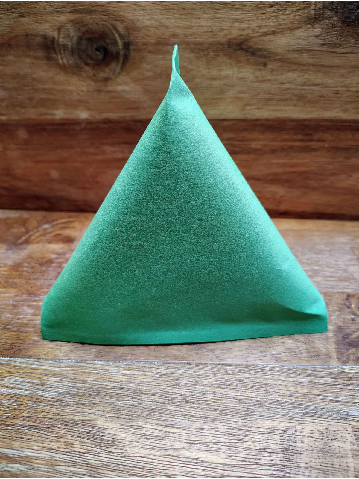 Christmas Tree Treat Bags- Step 6- Glue other end shut to make pyramid - Kids Activities Blog