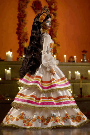 Day of the Dead Barbie- dark haired barbie with gold crown and marigolds, face paint, and festive dress against a background with candles - Kids Activities Blog
