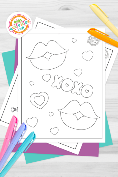 Black and white printable kissy lips coloring pages on top of blue-green and purple sheets with assorted crayons on a dark grey background. printed pdf version from Kids activities blog.