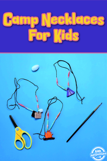 Camp Necklace Craft- 3 necklaces with charms on a blue background with craft supplies- kids activities blog