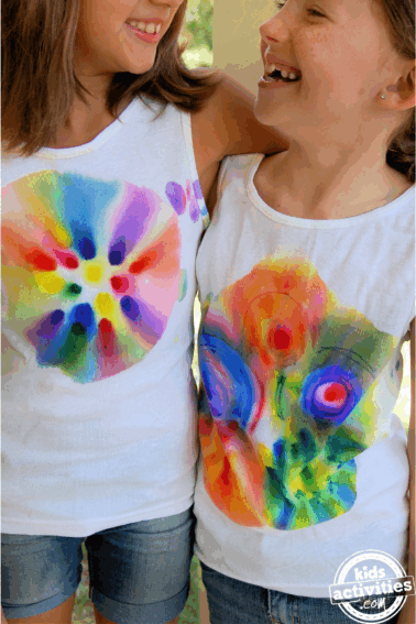 Tie Dye Science Experiment- Finished- two girls standing with tie dye shirts- kids activities blog